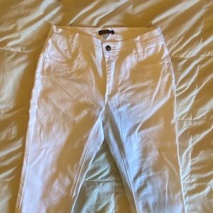 super cute pair of white mid rise flared jeans